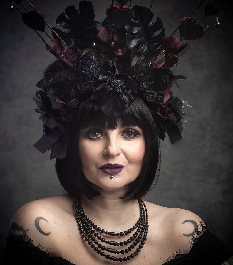 Anaïs Lune wearing an ornate black floral crown and multi-strand necklace