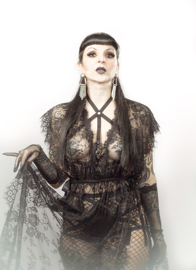 Anaïs Lune in black lace lingerie against white, black and white